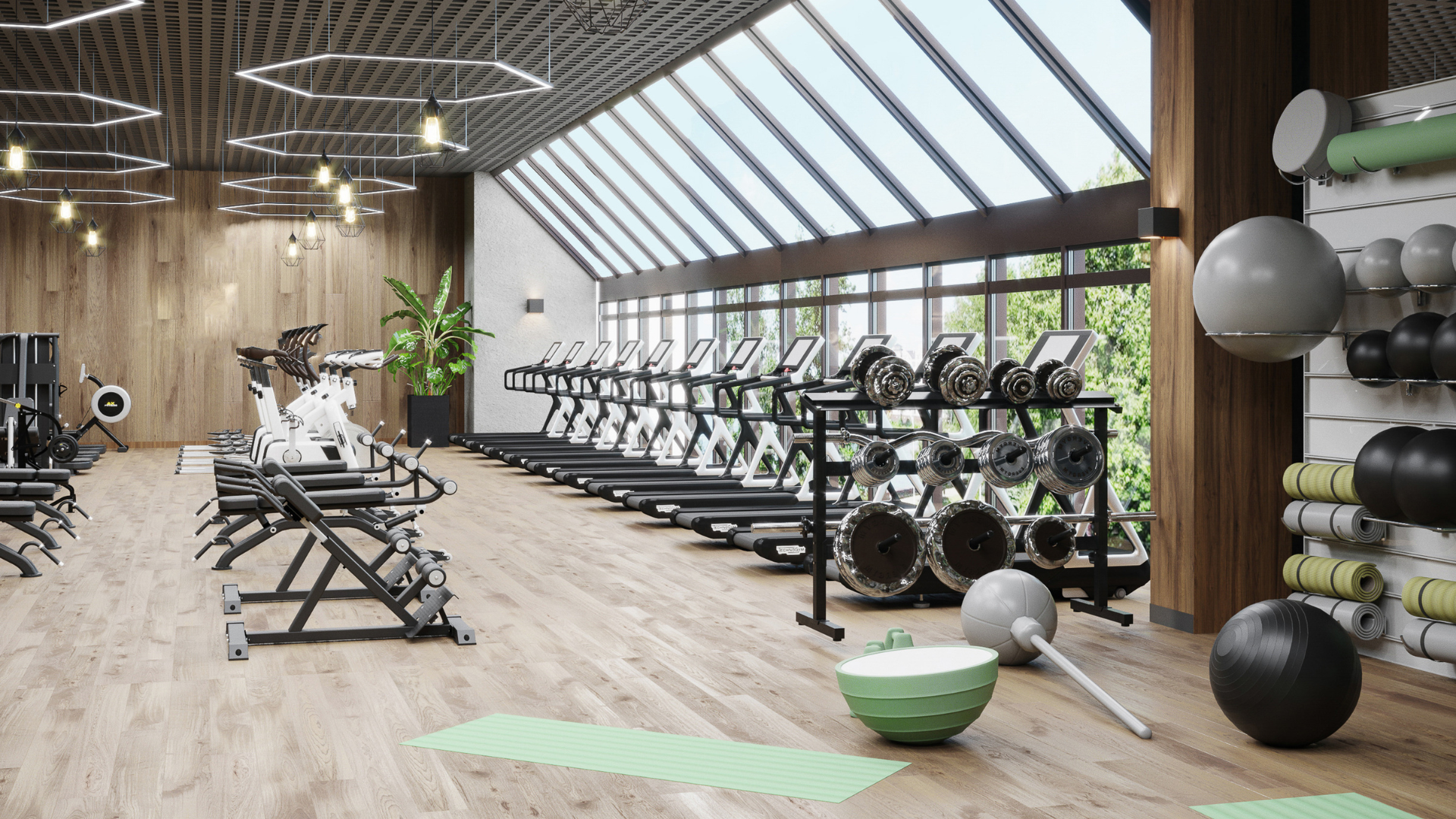 Spazio di allenamento in palestra, dotato di attrezzature e una grande finestra che consente l'ingresso di luce.